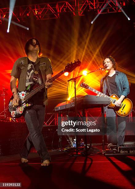 Korel Tunador and Robby Takac of The Goo Goo Dolls performs at the Meadow Brook Music Festival on July 17, 2011 in Rochester, Michigan.