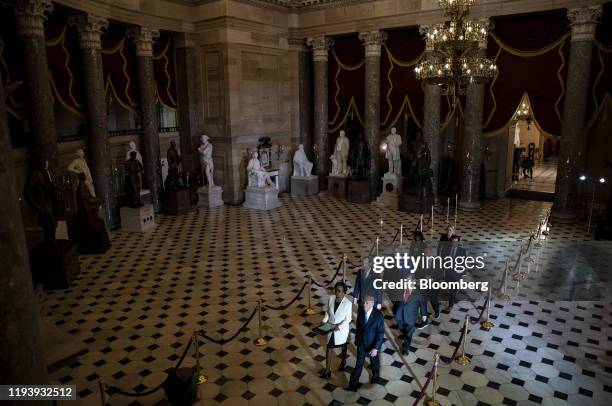 Articles of impeachment against President Donald Trump are delivered by House impeachment managers during a procession to the Secretary of the Senate...