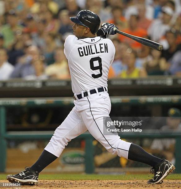 Carlos Guillen of the Detroit Tigers hits a two run home run in the fifth inning scoring Jhonny Peralta during the game against the Oakland Athletics...