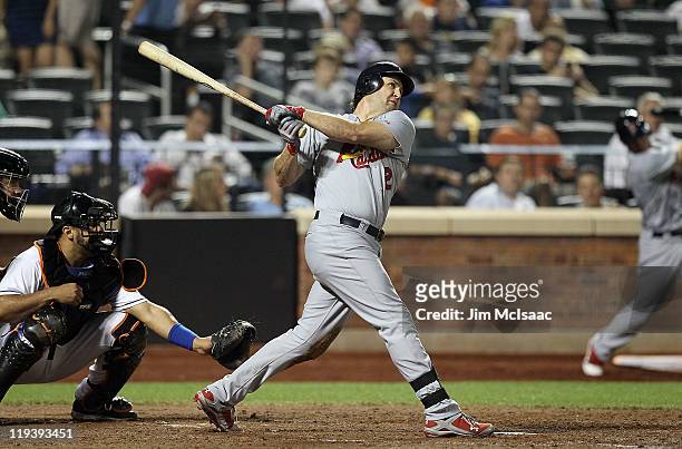 Lance Berkman of the St. Louis Cardinals hits a long seventh inning home run against the New York Mets at Citi Field on July 19, 2011 in the Flushing...