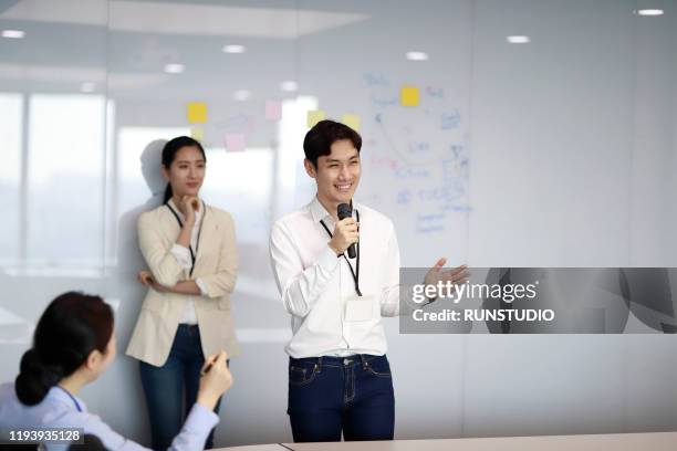 businessman giving presentation to colleagues - セミナー　日本人 ストックフォトと画像