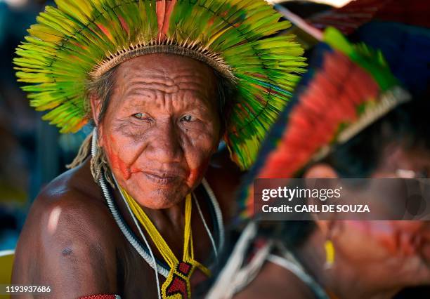 An indigenous tribesmen looks on before a speech by Indigenous leader Cacique Raoni of Kayapo tribe, in Piaracu village, near Sao Jose do Xingu, Mato...