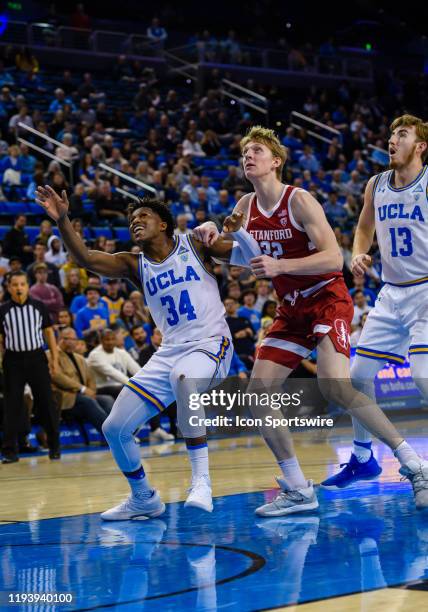 Bruins guard David Singleton tries to box out Stanford Cardinal forward James Keefe during the game between the Stanford Cardinal and the UCLA Bruins...