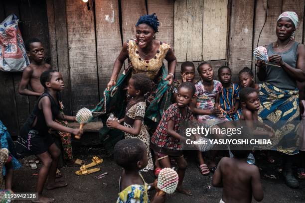 Picture taken on March 1, 2019 shows children learning to dance for their church event in the Makoko waterfront community in a polluted lagoon in...