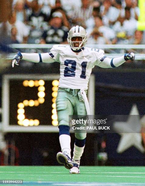 Deion Sanders of the Dallas Cowboys dances while waiting to return an Arizona Cardinals punt during early action at Texas Stadium in Irving, Texas 03...