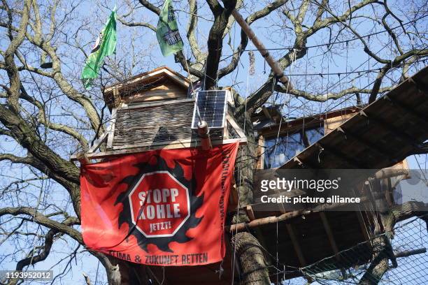 January 2020, North Rhine-Westphalia, Kerpen: A banner "Stop Coal Now!" is written on a banner at a tree house in Hambach Forest. The Hambach...