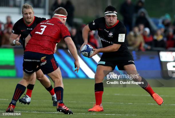 Jamie George of Saracens passes the ball during the Heineken Champions Cup Round 4 match between Saracens and Munster Rugby at Allianz Park on...