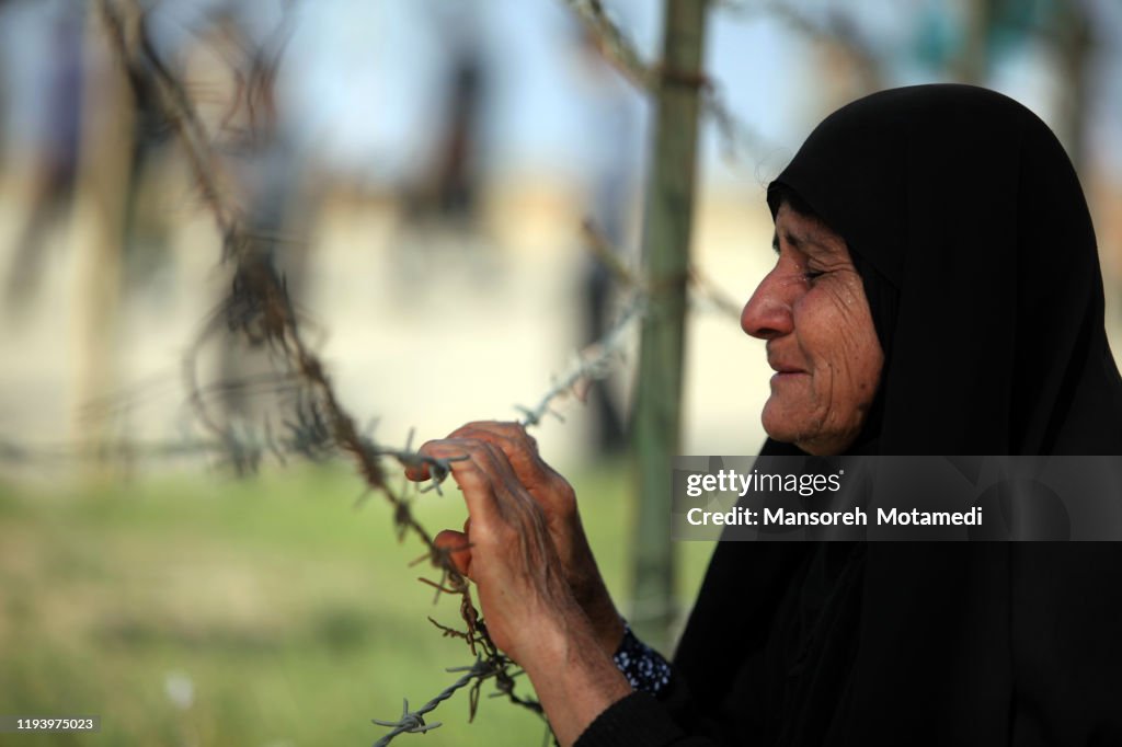 Iranian old Muslim woman is crying for her martyr