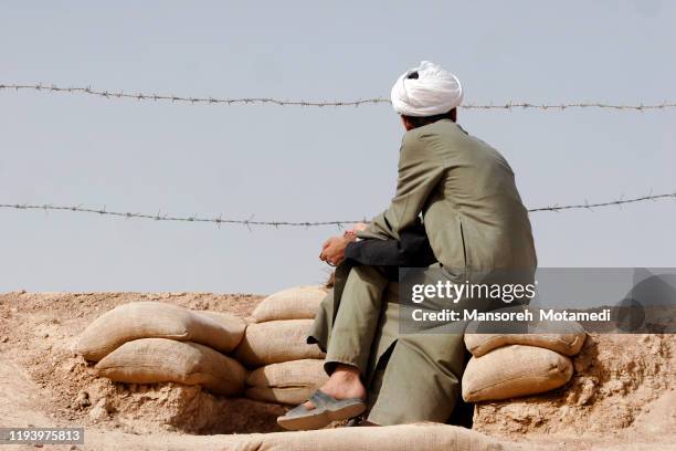 imam is praying in nature - mullah stock-fotos und bilder