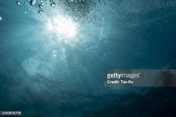 sunshine penetrate the ocean - penetrating stock pictures, royalty-free photos & images
