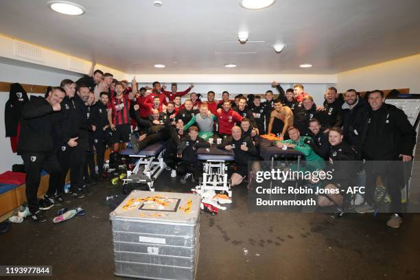 Bournemouth players and staff celebrate in the away dressing room after their 1-0 victory during the Premier League match between Chelsea FC and AFC...