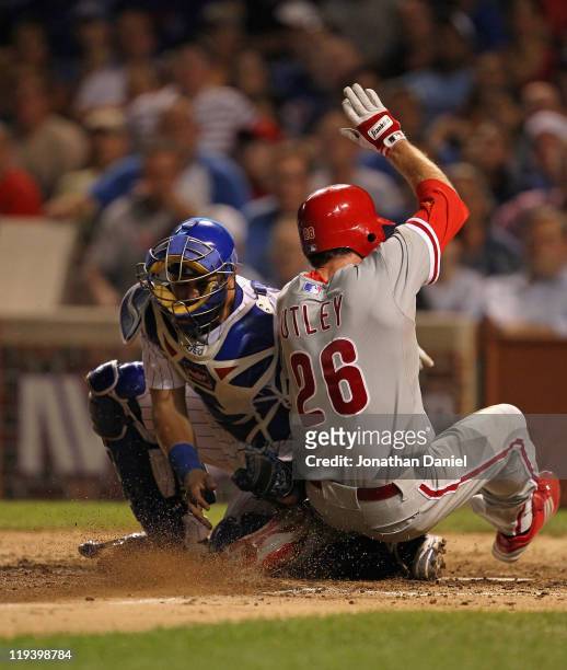 Geovany Soto of the Chicago Cubs tags out Chase Utley of the Philadelphia Phillies in the 8th inning at Wrigley Field on July 19, 2011 in Chicago,...