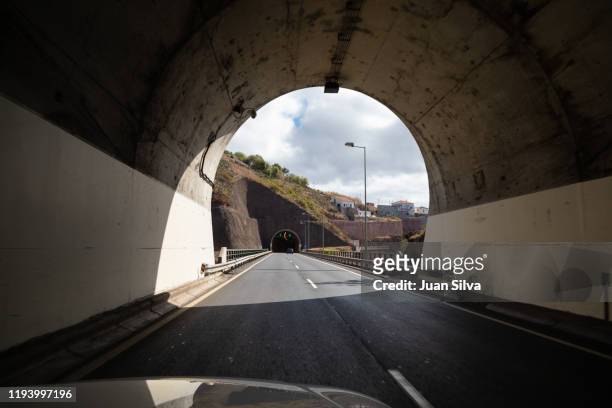 tunnels on highway, funchal, madeira, portugal. - 車道トンネル ストックフォトと画像