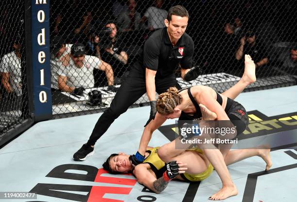 Irene Aldana of Mexico finishes Ketlen Vieira of Brazil in their women's bantamweight bout during the UFC 245 event at T-Mobile Arena on December 14,...