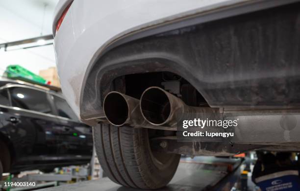exhaust pipe of a car - exhaust pipe stock pictures, royalty-free photos & images