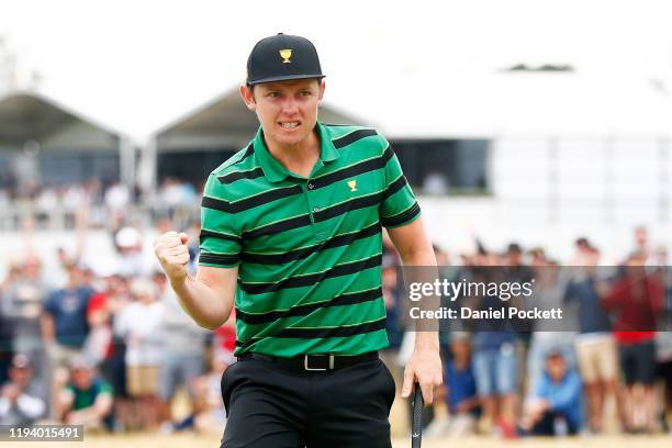 Cameron Smith of Australia and the International team celebrates defeating Justin Thomas of the United States team 2&1 during Sunday Singles matches...