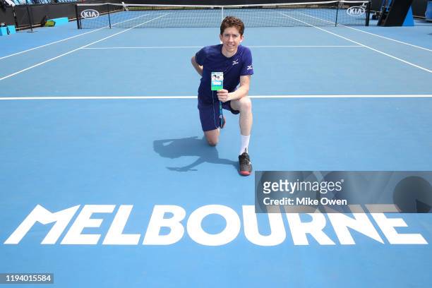 John Patrick Smith of Queensland poses in-front of the Melbourne sign after winning the Men's Singles Final 2019 Australian Open Wildcard Play-Off...