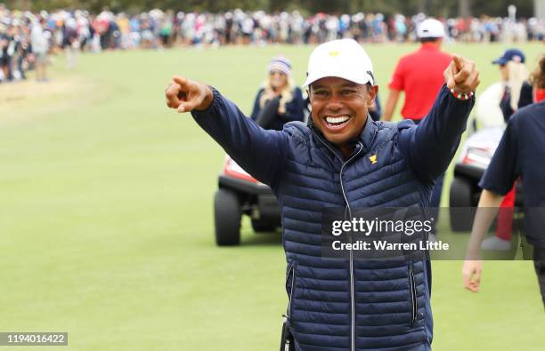 Playing Captain Tiger Woods of the United States team celebrates after clenching the Presidents Cup during Sunday Singles matches on day four of the...