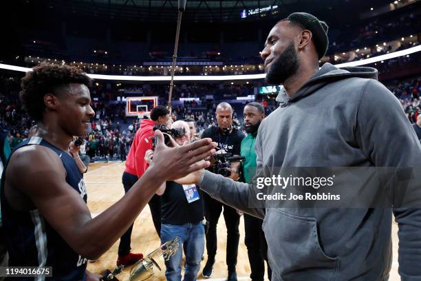 LeBron 'Bronny' James Jr. #0 of Sierra Canyon High School is greeted by his father LeBron James of the Los Angeles Lakers following the Ohio...