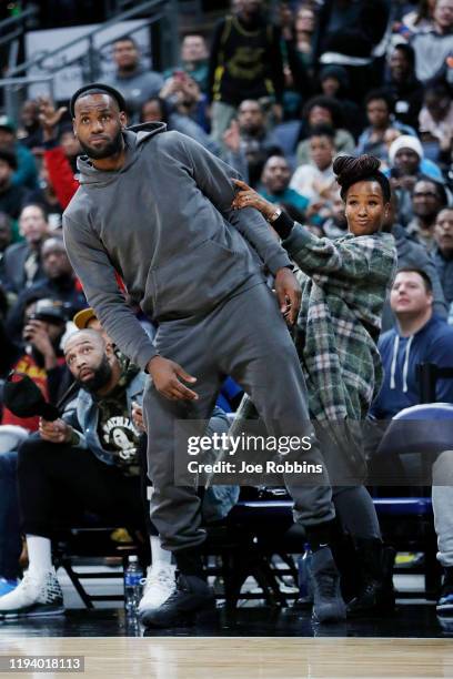 LeBron James of the Los Angeles Lakers and wife Savannah James react while watching Sierra Canyon High School during the Ohio Scholastic Play-By-Play...