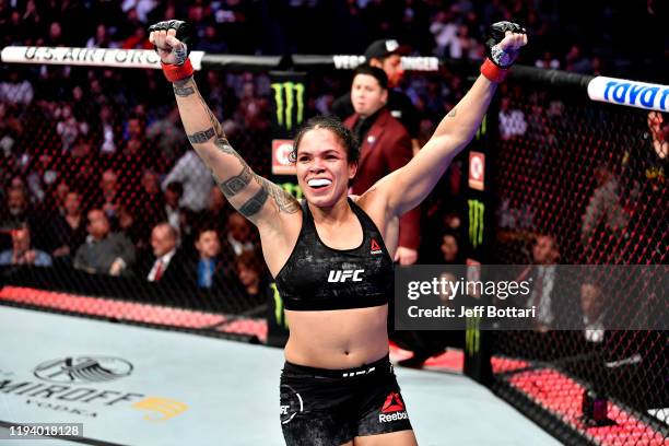 Amanda Nunes of Brazil celebrates in the octagon at the end of the round during the UFC 245 event at T-Mobile Arena on December 14, 2019 in Las...