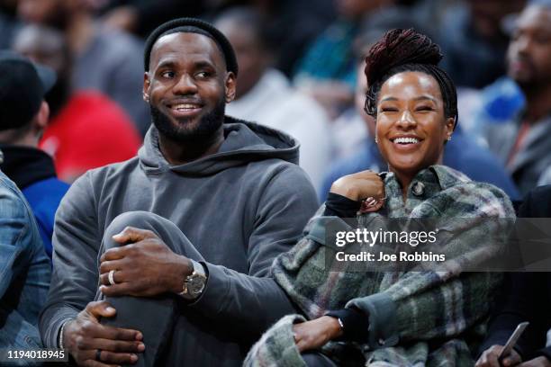 LeBron James of the Los Angeles Lakers and wife Savannah James look on while watching Sierra Canyon High School during the Ohio Scholastic...