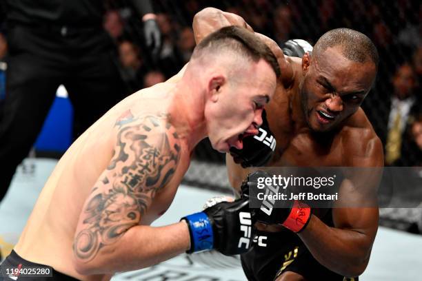 Kamaru Usman of Nigeria strikes Colby Covington in their UFC welterweight championship bout during the UFC 245 event at T-Mobile Arena on December...