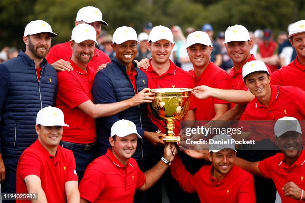 The United States team celebrates with the trophy after they won the Presidents Cup 16-14 during Sunday Singles matches 1on day four of the 2019...