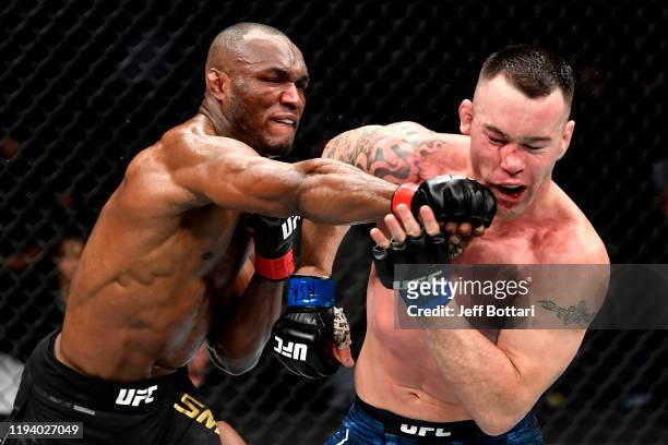Kamaru Usman of Nigeria strikes Colby Covington in their UFC welterweight championship bout during the UFC 245 event at T-Mobile Arena on December...