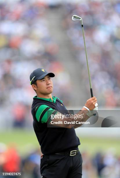 Hideki Matsuyam of the International Team plays his second shot on the 17th hole in his match against Tony Finau during the final day singles matches...
