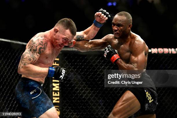 Kamaru Usman of Nigeria punches Colby Covington in their UFC welterweight championship bout during the UFC 245 event at T-Mobile Arena on December...