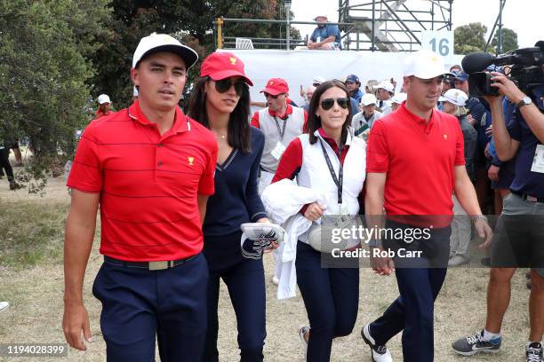 Rickie Fowler of the United States team, Allison Stokke, Justin Thomas of the United States team and Jillian Wisniewski celebrate after they won the...