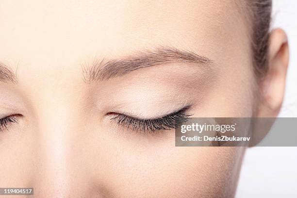 close-up woman's face - close eyes stock pictures, royalty-free photos & images