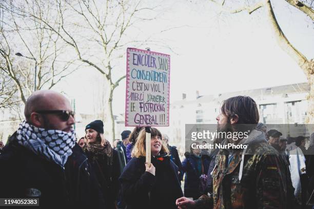 Woman holding a banner at the demonstration against retirement reform in Nantes, France, 16 January 2020