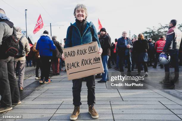 Woman holding a banner at the demonstration against retirement reform in Nantes, France, 16 January 2020