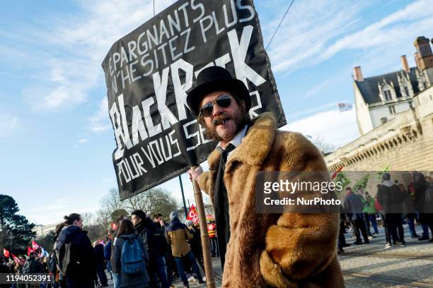 Actor dress-up as a representative of penssion found''black rock'' parody, at the demonstration against retirement reform in Nantes, France, 16...