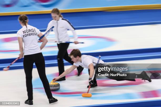 Oestgaard Nora, Hoestmaelingen Lukas and Forbregd Ingeborg from Norway - the Gold Medal winners - compete in gold medal game in Curling Mixed Team on...