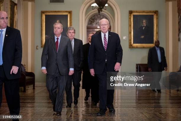 Sen. Lindsey Graham , Sen. Roy Blunt , Supreme Court Chief Justice John Roberts and Sen. Pat Leahy arrive to the Senate chamber for impeachment...