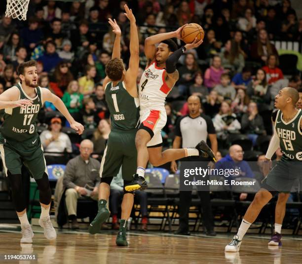 January 16: Jalen Adams of the Erie BayHawks passes the balls as D. J. Hogg of the Wisconsin Herd defends in a NBA G-League game on January 16, 2020...