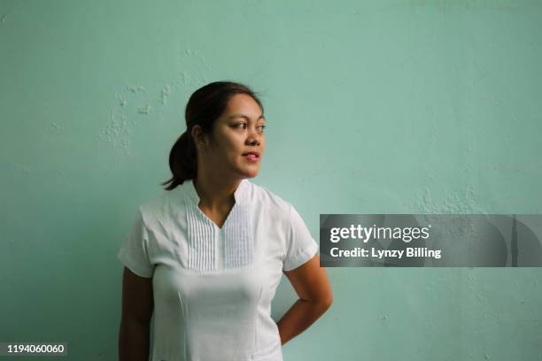 a nurse at a hospital - filipino woman stock-fotos und bilder