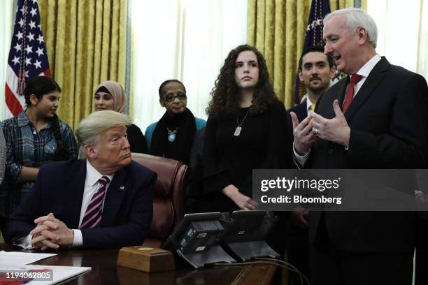 Jeffrey Rosen, deputy attorney general, right, speaks while U.S. President Donald Trump, left, listens during a meeting to announce new guidance...