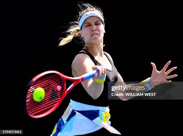 Eugenie Bouchard of Canada hits a return during her qualifying match against Martina Trevisan of Italy ahead of the Australia Open tennis tournament...