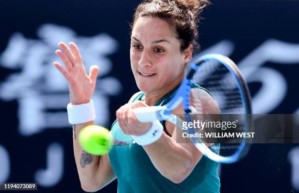 Martina Trevisan of Italy hits a return during her qualifying match victory over Eugenie Bouchard of Canada ahead of the Australia Open tennis...