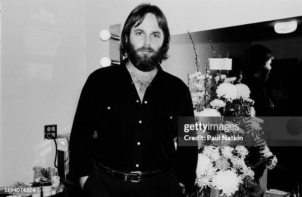 Portrait of American Rock and Pop musician Carl Wilson as he poses in a dressing room, backstage at the Park West, Chicago, Illinois, April 5, 1981.