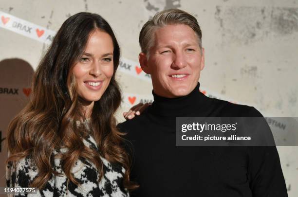 January 2020, Berlin: Bastian Schweinsteiger, national soccer player, and his wife Ana Ivanovic at a customer event of the label Brax in the building...
