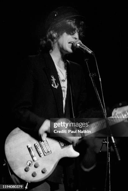 Scottish musician Mike Scott, of the group the Waterboys, plays guitar as he performs onstage at the Metro, Chicago, Illinois, November 5, 1985.