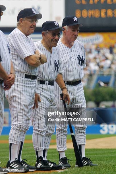 Former 1961 World Series champion New York Yankees teammates Manager Ralph Houk, Yogi Berra and Whitey Ford participate in pre-game ceremony at Old...