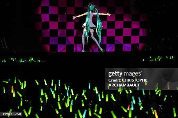 Japanese virtual singer Hatsune Miku performs on stage during a concert at the Zenith concerthall, in Paris, on January 16, 2020.