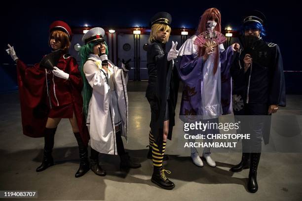 Dressed-up fans pose ahead of Japanese virtual singer Hatsune Miku concert at the Zenith concerthall, in Paris, on January 16, 2020.