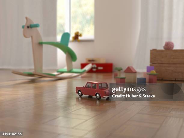 rocking horse in playroom - car interieur stock-fotos und bilder